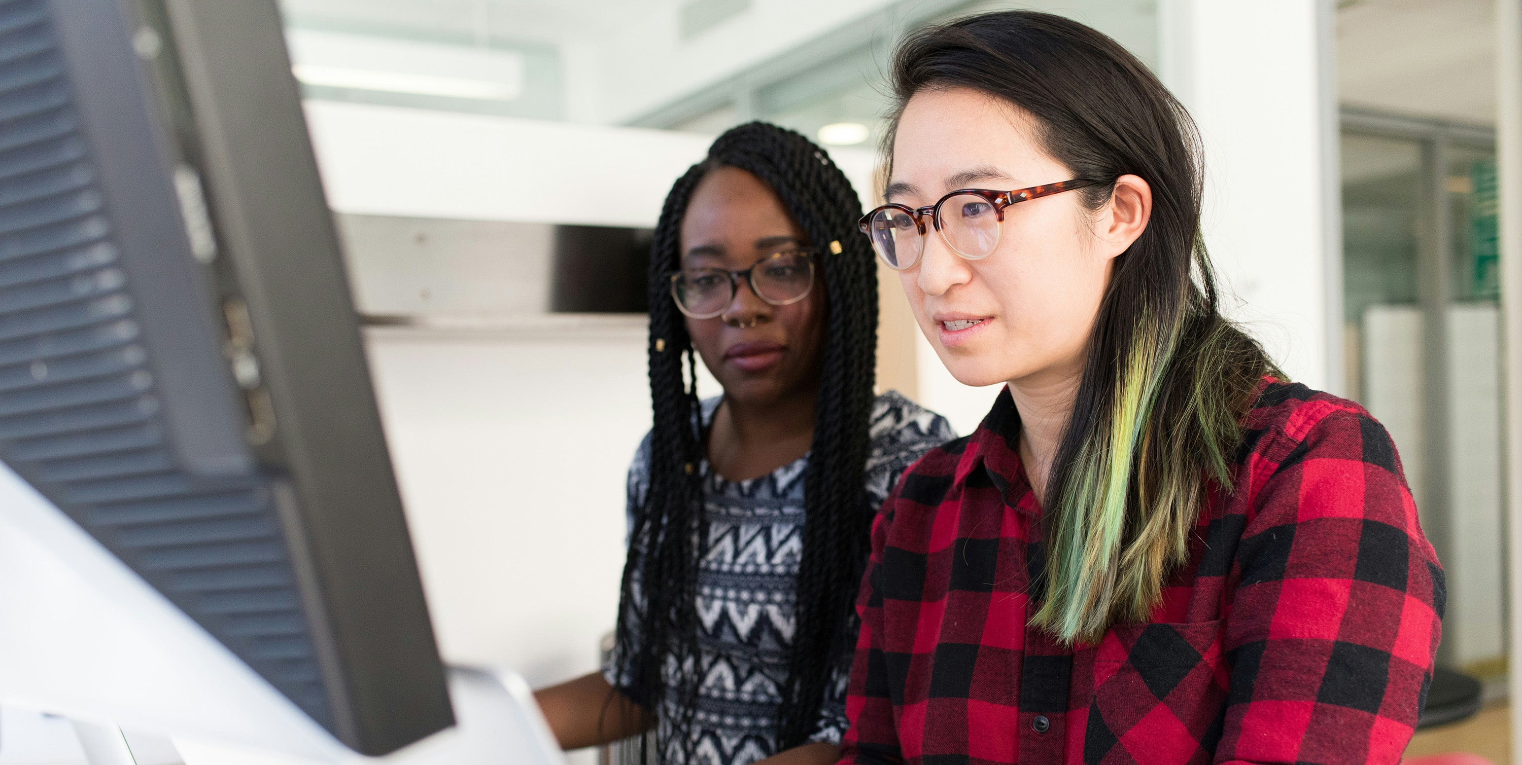 IT professionals collaborating on software development and system solutions
